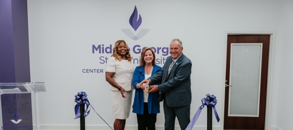 MGA representatives cutting the ribbon at the center grand opening.